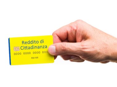 Citizenship income, hand with credit card. grant from the Italian state